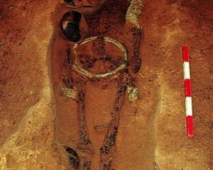 This elite man was interred about 1800 years ago with a great weight of bronze ornaments, fine...