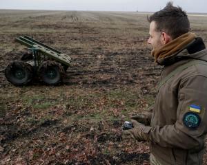 A serviceman of 13th Operative Purpose Brigade 'Khartiia' of the National Guard of Ukraine...