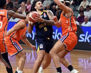 Jose Perez of the Nuggets is crowded out by the Sharks' defence. Photo: Linda Robertson 