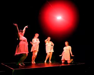 Performers pose on stage during a dress rehearsal ahead of the opening night of Burly Q, at this...