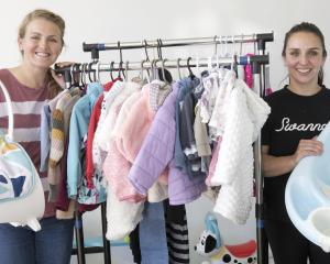 Kids preloved Winter Market organiser Karena Garrett (left) and volunteer and seller Belen...