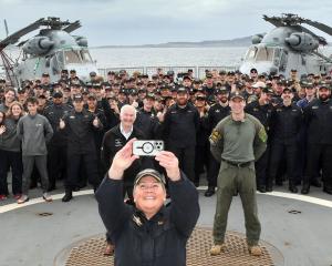 Cmdr Bronwyn Heslop takes a selfie with the ship’s company before HMNZS Canterbury berths at...