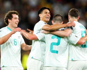 Joe Bell, Marko Stamenić, Tim Payne and Chris Wood celebrate during Friday night's win over Fiji....