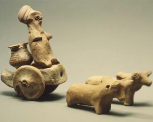 A toy model of a wheeled cart from Chanhu Daro, a city of the Indus civilization, 3000-2500 BC....