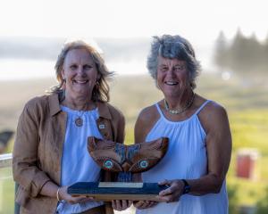 Surf Life Saving New Zealand life members Marilyn Moffatt (left) and Carol Quirke hold the Pat...