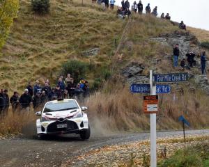 Spectators watch Mike Young at last year’s Otago Rally, near Middlemarch. PHOTO: DAVID THOMSON
