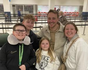 Simon and Lynne Usher, pictured with their children, were awarded just over $18,000 in a Tenancy...