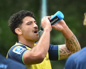 Highlanders flanker TK Howden cools off during a training session in Dunedin this week. Photo:...