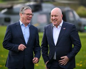 British Prime Minister Keir Starmer greets Christopher Luxon after he arrives for a visit to a...