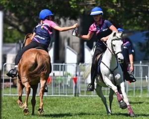 Georgia Dee, left, and Sophie Eade competing in Mounted Games at Horse of the Year in Hastings...