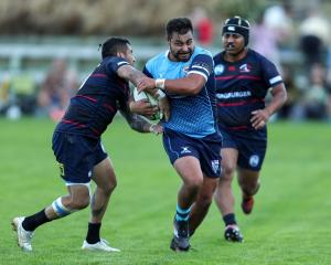 Wakatipu winger Xavier Sadler, in his 50th game for the Prems, tries to shrug off Arrowtown first...