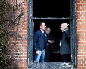 Pennsylvania Governor Josh Shapiro (left) inspects the damage with police. Photo: Commonwealth...