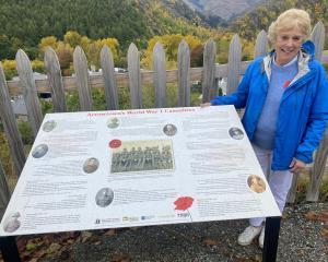 Denise Heckler with Arrowtown’s new WWI memorial panel on Soldiers Hill. PHOTO: PHILIP CHANDLER