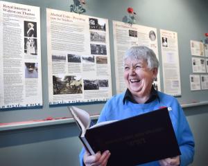 Port Chalmers Maritime Museum exhibition curator Shirley Jack reads a book she put together about...