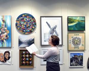 Aislinn Roodt, of Dunedin, admires the works on display in the 2025 Cleveland National Art Awards...