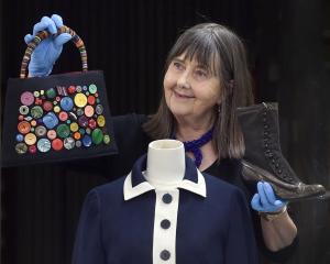 Tuhura Otago Museum honorary curator Dr Jane Malthus shows off a range of garments which will be...