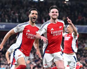 Arsenal goal scorers Mikel Merino and Declan Rice celebrate after Merino's goal during their 3-0...