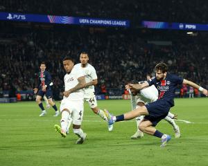 Khvicha Kvaratskhelia of Paris Saint-Germain scores his team's second goal during the UEFA...
