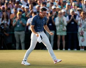 Rory McIlroy celebrates winning the Masters after a playoff hole at Augusta National Golf Club...