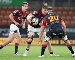 Fabian Holland of the Highlanders braces for the tackle during their match against the Chiefs in...