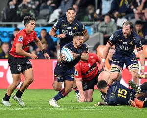 Highlanders halfback Folau Fakatava makes a break during the Super Rugby game at Forsyth Barr...