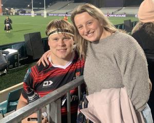 George Bell and sister Lucy celebrate after a Crusaders match in Christchurch. PHOTO: SUPPLIED