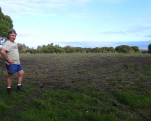 An unhappy John Laing surveys the result of a weekend of burnouts in Kakanui. PHOTO: BRENDON MCMAHON