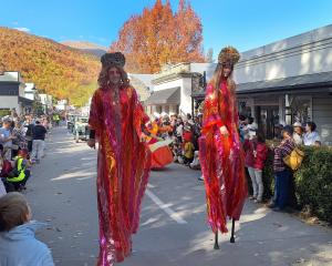 These stilt walkers captivated the crowds during the Arrowtown Autumn Festival street parade....