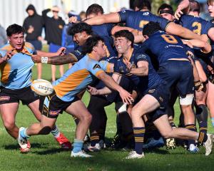 Halfbacks clash during the Dunedin premier rugby match between University and Dunedin at Logan...