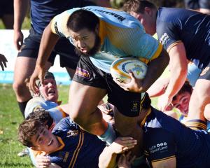 University prop Steve Salelea tries to get away from the Dunedin defence during the division 1...