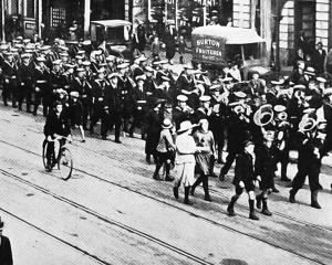 Sailors of the Royal Navy New Zealand Squadron flagship HMS Dunedin parade in Princes St, Dunedin...
