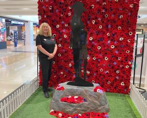 Golden Centre manager Nina Rivett stands with the centre’s Anzac Day display, honouring all those...