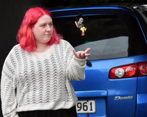 Andersons Bay resident Breeanna Rawlinson with her Mazda Demio which was stolen from outside her...