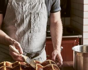 Putting the finishing touches on Easter buns. Photography: ©Rochelle Eagle&nbsp;