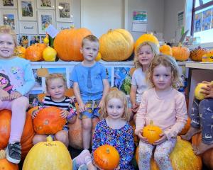 Showing off their pumpkins are Learning Barn preschoolers (from left) Willow Burbery, 4, Lucy...