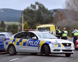 Police pull over a vehicle in Horse Range Rd, Palmerston, yesterday. PHOTOS: PETER MCINTOSH