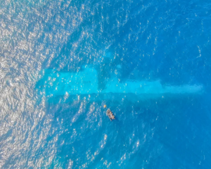 NZ Navy divers surveying the area around the sunken Manawanui warship in October last year. Photo...