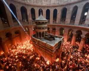 People gather at the Church of the Holy Sepulchre, Jerusalem, for the Holy Fire ceremony. PHOTO:...