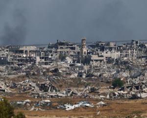 Smoke rises from Gaza. PHOTO: REUTERS
