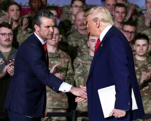 Defense Secretary Pete Hegseth (left) with President Donald Trump an event at Selfridge Air...