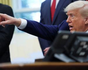 US President Donald Trump takes questions in the Oval Office. Inset: Emperor Nero. PHOTOS:...