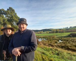 Waikākahi farmer Martin Cochrane, with daughter Jess, alongside a wetland on their farm. PHOTO:...