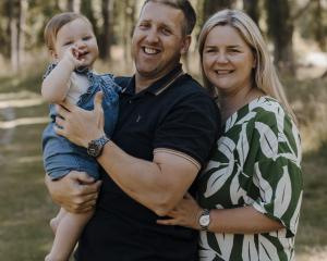 Louise Scott-Gallagher with husband Craig and daughter Lily earlier this year. PHOTO: LULLABY...