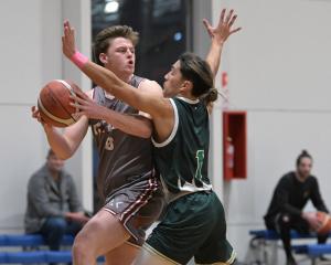 Mid City Magic’s Toby Lewis looks for his options under the pressure of City Rise Bombers’...