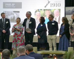 Associate Minister of Agriculture Mark Patterson (left) presents the Philip family, of Stoneburn,...