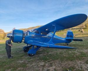 Callum Smith with the Beech D-17S Staggerwing VH-BBL. PHOTO: SUPPLIED