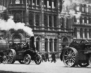 Steam traction engines haul a drum of replacement cable up Rattray St to the Roslyn cable car...