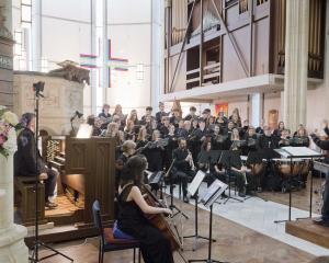 The Southern Youth Choir and Chamber Orchestra are directed by John Buchanan in a performance of...