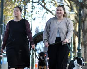 Katelyn Waugh (left), with Gary, and Sam Sinclair, with Lola, make the most of the new bylaw...