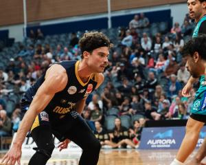 Otago Nuggets hustler Matthew Bardsley guards an Auckland Tuatara player during an NBL match in...